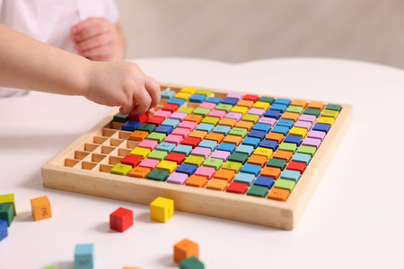Motor skills development. Little boy playing with table tray indoors, closeupの写真素材