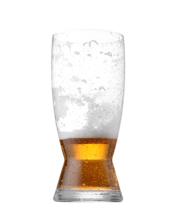 Half full glass of beer isolated on whiteの写真素材