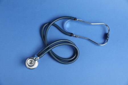 Stethoscope on blue background, top view. Medical toolの写真素材