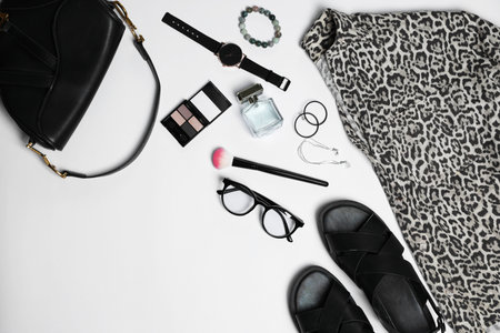 Stylish women's clothes and different accessories on white background, flat lay. Space for text