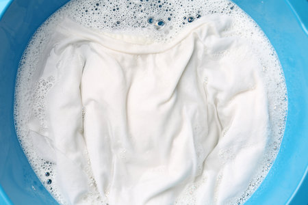 White clothes soaked in water before washing, top viewの写真素材