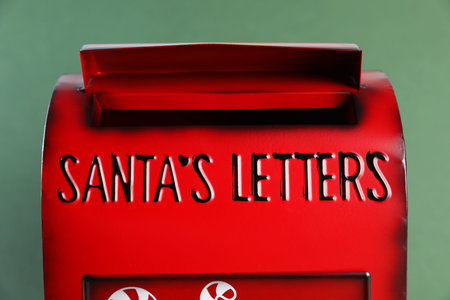 Santa Claus mail box on dark green background, closeup. Christmas tradition