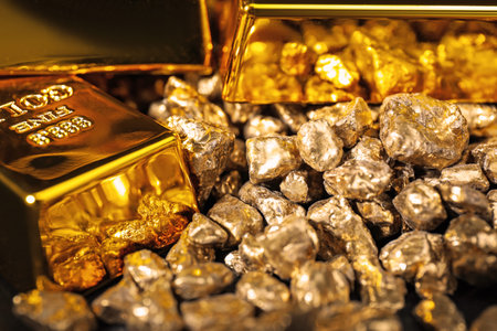 Gold nuggets and bars as background, closeup