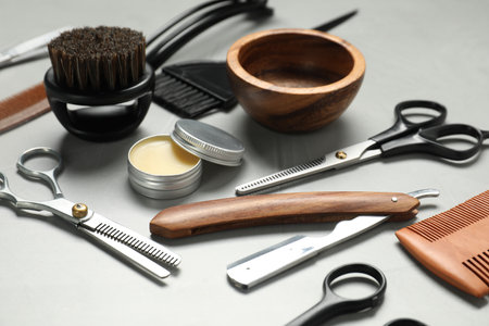 Many different barber's tools on light grey table, closeupの写真素材