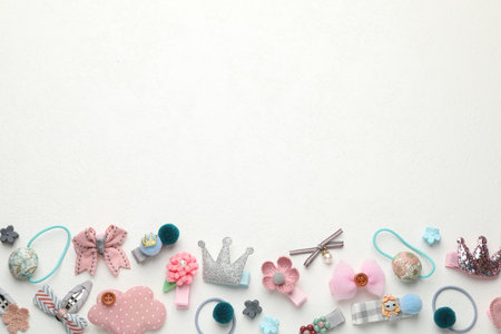 Different hair accessories on white table, flat lay. Space for textの写真素材