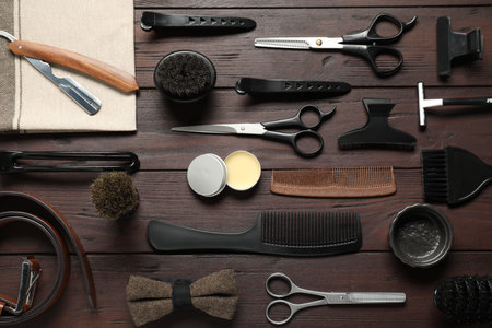 Many different barber's tools on wooden table, flat layの写真素材