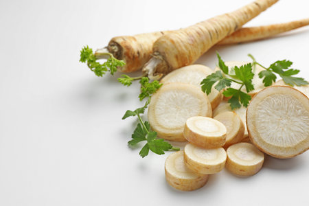 Parsley roots and leaves on white background, closeupの写真素材