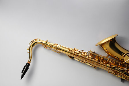 Jazz. One saxophone on light grey background, top view. Space for textの写真素材