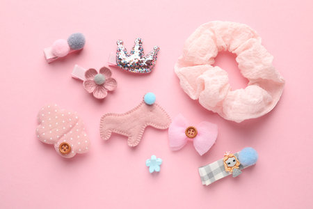 Different hair accessories on pink background, flat layの写真素材