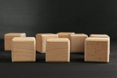 Blank wooden cubes on black table, closeupの写真素材