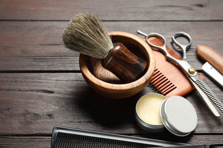 Many different barber's tools on wooden table, closeupの写真素材