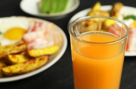 Tasty brunch. Refreshing drink and dishes on dark table, closeupの写真素材