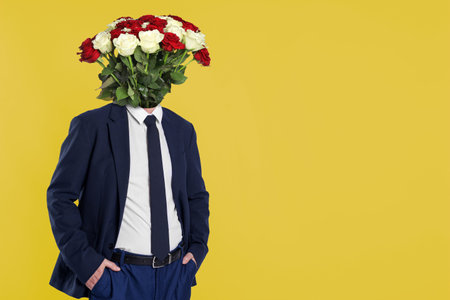 Man with bouquet of flowers instead of his head on yellow background, space for text. Creative art collageの写真素材