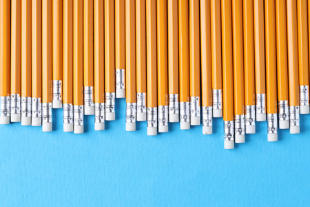 Many pencils on light blue background, top viewの写真素材