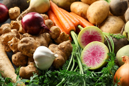 Different raw root vegetables as background, closeup