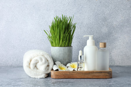 Spa composition with wheatgrass on grey tableの写真素材