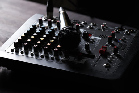Professional mixing console with microphone on table, closeupの写真素材