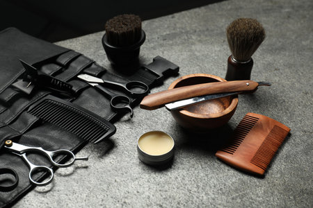Many different barber's tools on gray textured table, closeupの写真素材