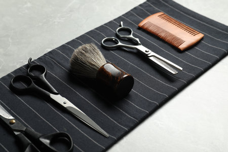 Many different barber's tools on light gray table, closeupの写真素材