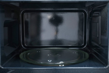 Open empty microwave oven, closeup. Inside viewの写真素材