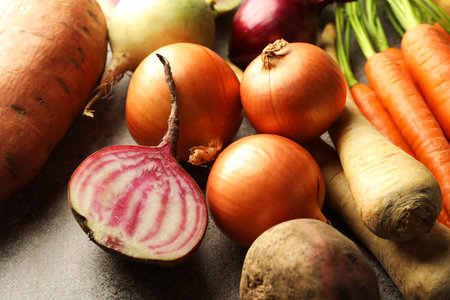Different root vegetables on grey table, closeupの写真素材