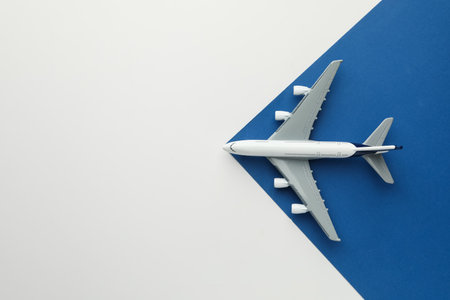 One plane model on color background, top view. Space for textの写真素材