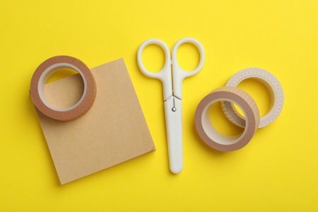 Different stationery on yellow background, flat layの写真素材