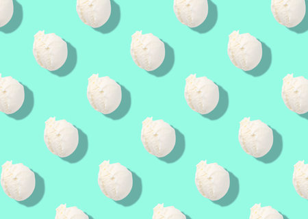 Pattern of delicious ice cream scoops on turquoise background