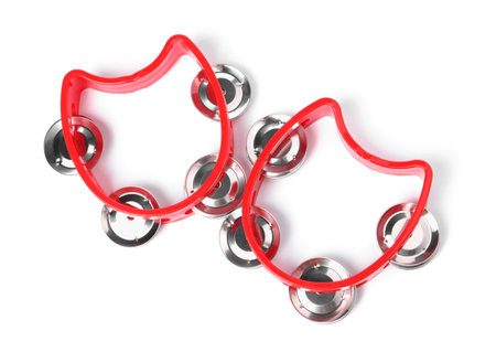 Red toy tambourines isolated on white, top view. Child's musical instrumentの写真素材