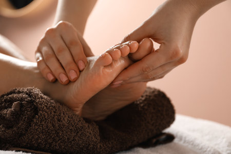 Woman receiving foot massage in spa salon, closeupの写真素材