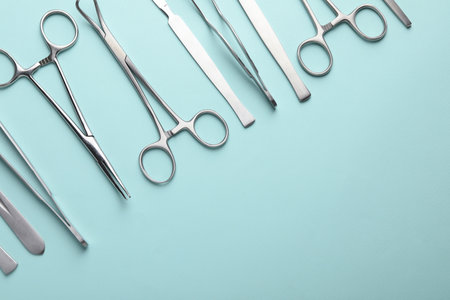 Different surgical tools on turquoise background, flat lay. Space for textの写真素材