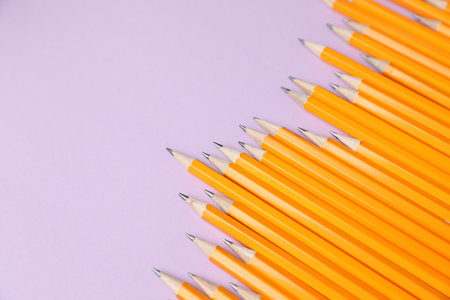Many pencils on violet background, above view. Space for textの写真素材