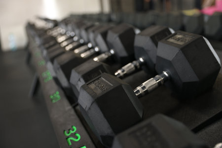 Different many dumbbells in gym. Sport equipmentの写真素材