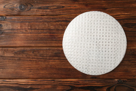 Stack of edible rice paper sheets on wooden table, top view. Space for textの写真素材