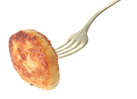 Fork with tasty patty isolated on whiteの写真素材