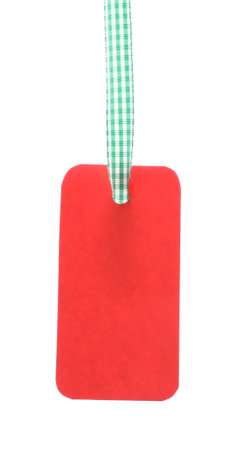 Blank tag with ribbon isolated on whiteの写真素材