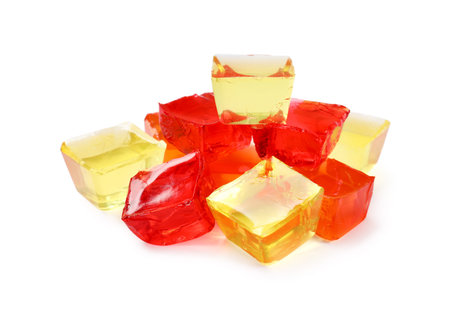 Different tasty jelly cubes isolated on white