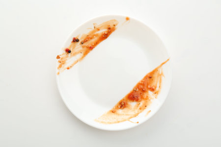 One dirty plate isolated on white, top viewの写真素材