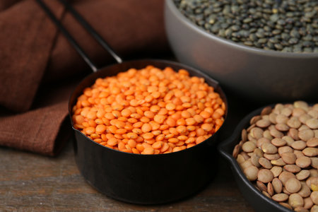Different types of lentils on wooden table, closeupの写真素材