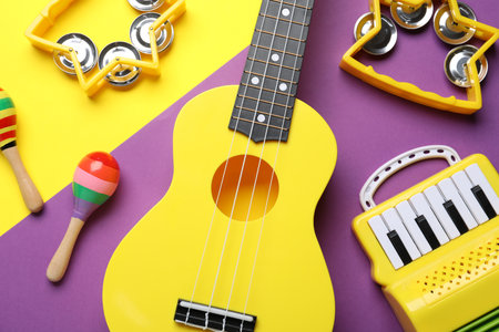 Flat lay composition with different toy musical instruments on color backgroundの写真素材