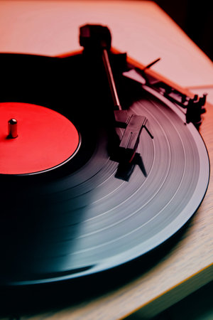 Turntable with vinyl record, closeup. Color toned