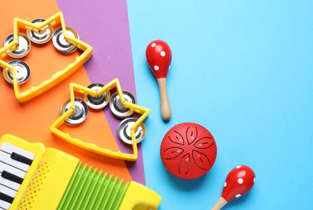 Flat lay composition with different toy musical instruments on color background. Space for textの写真素材