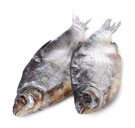 Dried salted roach fish isolated on whiteの写真素材