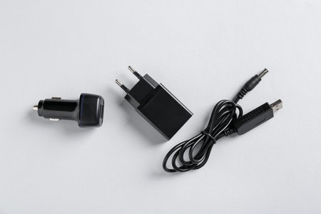 USB power adapter, charge cable and car charger on white background, flat layの写真素材