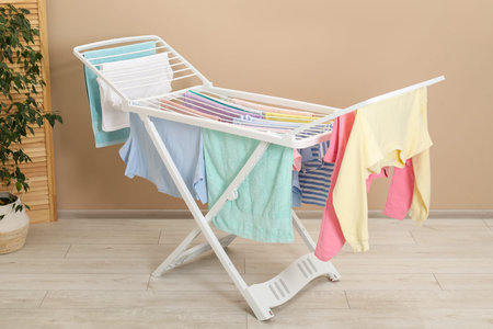 Drying rack with fresh clean laundry at home