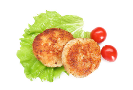 Delicious patties, tomatoes and lettuce isolated on white, top viewの写真素材