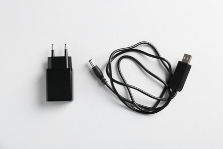 USB power adapter and charge cable on white background, flat layの写真素材