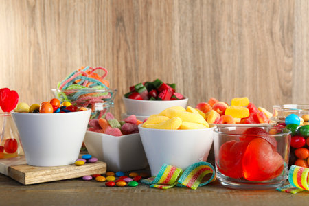 Candy bar. Many different sweets on wooden tableの写真素材