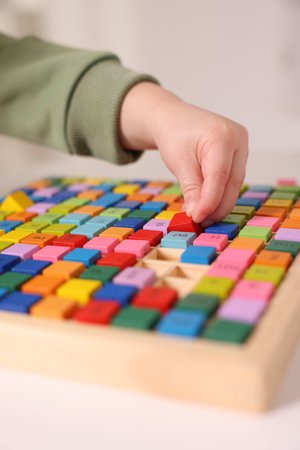 Motor skills development. Little boy playing with table tray indoors, closeupの写真素材