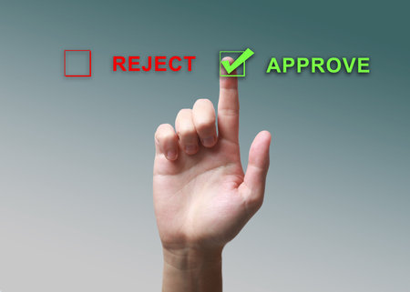 Man selecting Approve on virtual screen against color gradient background, closeupの写真素材